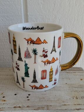 Wanderlust White Stoneware Mug with Gold Handle and Multicolor Travel Icons